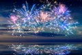 Beautiful happy new year fireworks in the sky with reflections on water Royalty Free Stock Photo