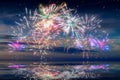 Beautiful happy new year fireworks in the sky with reflections on water Royalty Free Stock Photo