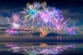 Beautiful happy new year fireworks in the sky with reflections on water Royalty Free Stock Photo