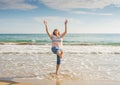 Beautiful happy senior woman living an active retirement lifestyle with joy at the beach Royalty Free Stock Photo