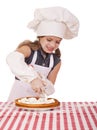 Beautiful happy seven year old girl in chef uniform with shortca Royalty Free Stock Photo