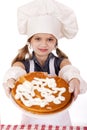 Beautiful happy seven year old girl in chef uniform with shortca Royalty Free Stock Photo