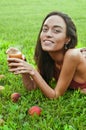 Beautiful happy skinny young woman smiling with a glass of juice