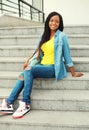 Beautiful happy smiling african woman wearing a jeans shirt Royalty Free Stock Photo