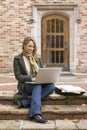 Beautiful, happy, smiling, female woman college university student studying using laptop computer on campus Royalty Free Stock Photo