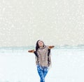 Beautiful happy smiling girl woman walking in a field on a winter evening, and happy snow Royalty Free Stock Photo