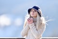 Beautiful happy smiling winter woman with mug outdoor holding cu Royalty Free Stock Photo