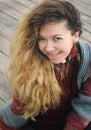 Beautiful happy smiling woman portrait with long hairs dressed in gray jersey