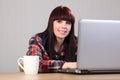 Beautiful happy student doing homework on laptop Royalty Free Stock Photo