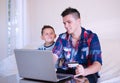 Beautiful happy two brothers buying online Royalty Free Stock Photo
