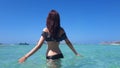 Beautiful happy woman in bikini in turquoise water. Balos beach, Greece Royalty Free Stock Photo