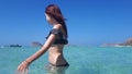 Beautiful happy woman in bikini in turquoise water. Balos beach, Greece Royalty Free Stock Photo