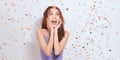 Beautiful happy woman at celebration party with confetti falling everywhere on her Royalty Free Stock Photo