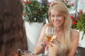 Female friends enjoying drinks on bar terrace