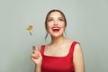 Beautiful happy woman eating healthy food holding fork with tomatoes and lettuce on white background. Healthy eating and diet Royalty Free Stock Photo