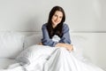 Beautiful happy woman enjoying morning time in bed Royalty Free Stock Photo