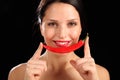 Beautiful happy woman holding red chili pepper Royalty Free Stock Photo