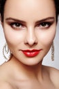 Beautiful happy woman in luxury fashion earrings. Diamond shiny jewelry with brilliants. retro style portrait