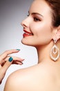 Beautiful happy woman in luxury fashion earrings. Diamond shiny jewelry with brilliants. retro style portrait