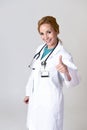 Beautiful and happy woman md doctor or nurse posing smiling cheerful with stethoscope Royalty Free Stock Photo