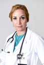 Beautiful and happy woman md doctor or nurse posing smiling cheerful with stethoscope Royalty Free Stock Photo