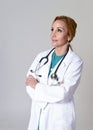 Beautiful and happy woman md doctor or nurse posing smiling cheerful with stethoscope Royalty Free Stock Photo