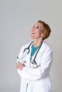 Beautiful and happy woman md doctor or nurse posing smiling cheerful with stethoscope Royalty Free Stock Photo