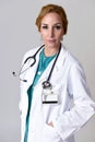 Beautiful and happy woman md doctor or nurse posing smiling cheerful with stethoscope Royalty Free Stock Photo