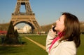 Beautiful happy woman with mobile phine in Paris Royalty Free Stock Photo