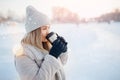 Beautiful happy woman outdoor winter. Laughing girl with hot drink tea or coffee with snowfall Royalty Free Stock Photo