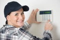 beautiful happy woman push button digital thermostat at house Royalty Free Stock Photo