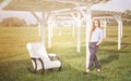 Beautiful happy woman relax in chair on lake morning