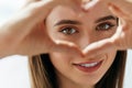 Beautiful Happy Woman Showing Love Sign Near Eyes. Royalty Free Stock Photo