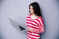 Beautiful happy woman standing with laptop Royalty Free Stock Photo