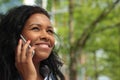 Beautiful happy young black woman outside in the park Royalty Free Stock Photo
