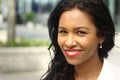 Beautiful happy young black woman outside in the park Royalty Free Stock Photo