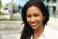 Beautiful happy young black woman outside in the park Royalty Free Stock Photo