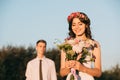 beautiful happy young bride holding wedding bouquet and groom Royalty Free Stock Photo