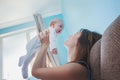 Beautiful happy young brunette woman with newborn baby on her ha Royalty Free Stock Photo