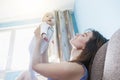 Beautiful happy young brunette woman with newborn baby on her hands, family happiness, love and care concept, mother day Royalty Free Stock Photo