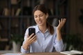 Beautiful happy young business lady holding mobile video call conversation. Royalty Free Stock Photo