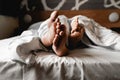 Beautiful happy young couple or family waking up together in bed