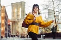 Beautiful happy young fashionable woman traveling in New York City with backpack. Royalty Free Stock Photo