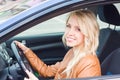 Beautiful happy young girl sitting in the car Royalty Free Stock Photo