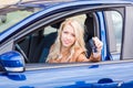 Beautiful happy young girl sitting in the car Royalty Free Stock Photo