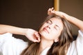 Beautiful happy young long haired woman waking up Royalty Free Stock Photo