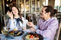 Beautiful young married couple having a great time eating dinner in a restaurant Royalty Free Stock Photo