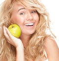 Beautiful and happy young woman with apple. Royalty Free Stock Photo