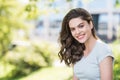 Beautiful happy young woman closeup portrait. Pretty model girl with perfect fresh clean skin smiling  outdoors Royalty Free Stock Photo