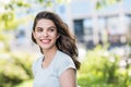 Beautiful happy young woman closeup portrait. Pretty model girl with perfect fresh clean skin smiling  outdoors Royalty Free Stock Photo